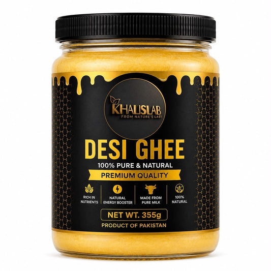 A jar of Khalislab Desi Ghee on a plain white background. The product is a clear glass jar filled with golden yellow ghee, topped with a black screw-on lid and featuring a black label with gold text and honeycomb patterns.